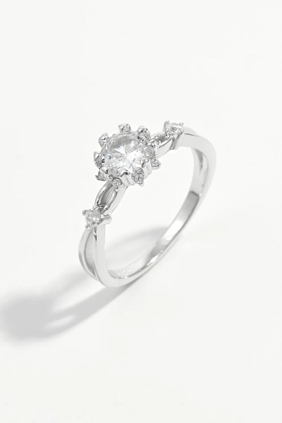 Silver halo ring with floral zirconia accents