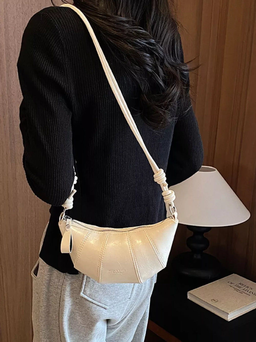 crossbody bag in ivory with stitched details and small