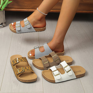 Buckle strap open toe sandals in khaki animal print, gray, brown, and gray/white with cork soles.