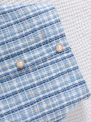 Light blue plaid puff sleeve top and skirt set with pearl buttons.