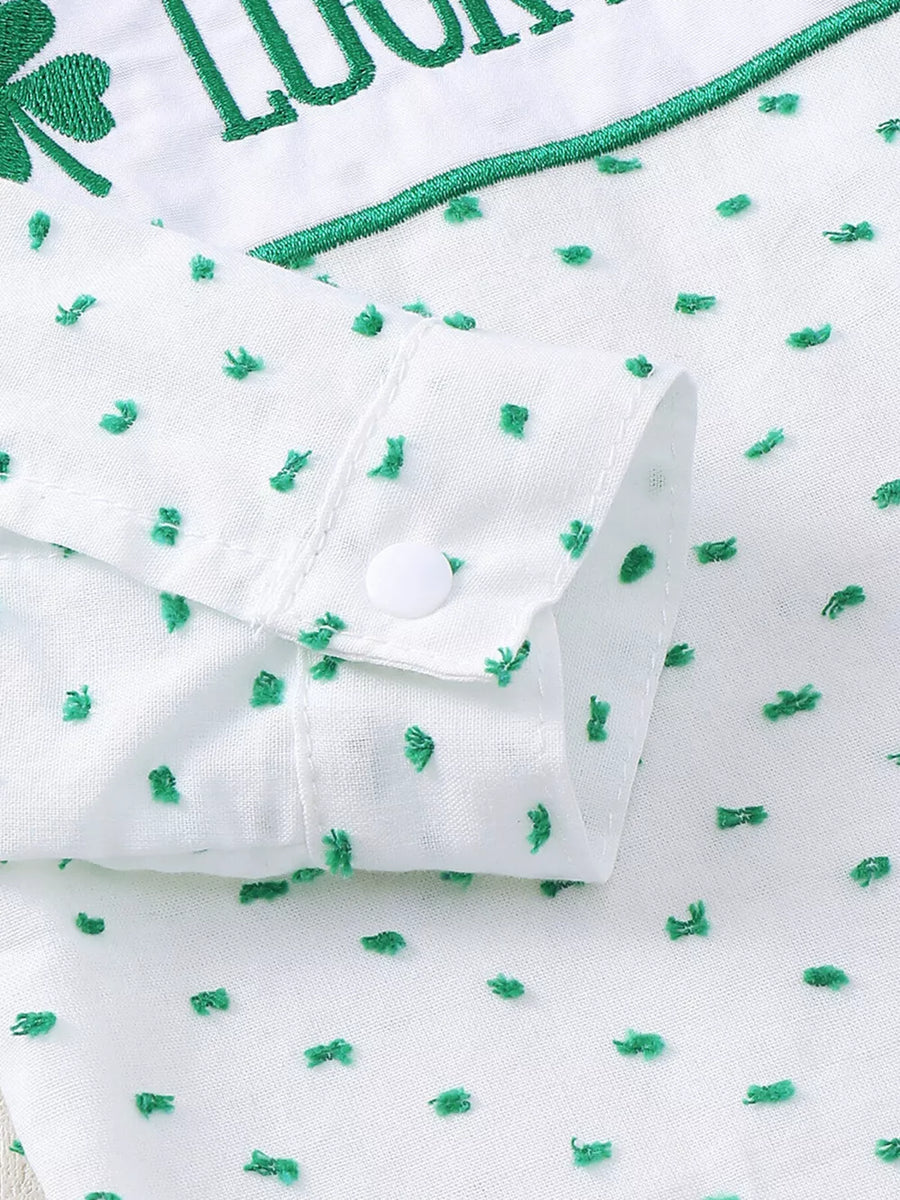 White cotton baby set with green embroidered shamrocks and text, featuring a buttoned cuff.