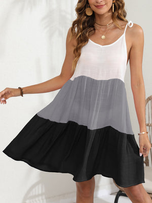 Tiered black and grey summer dress with white top and tie straps.