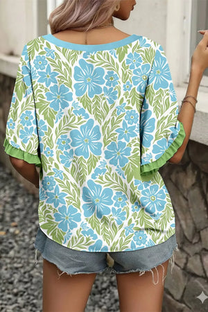 Floral ruffled half sleeve maternity blouse with blue flowers and green leaves pattern.