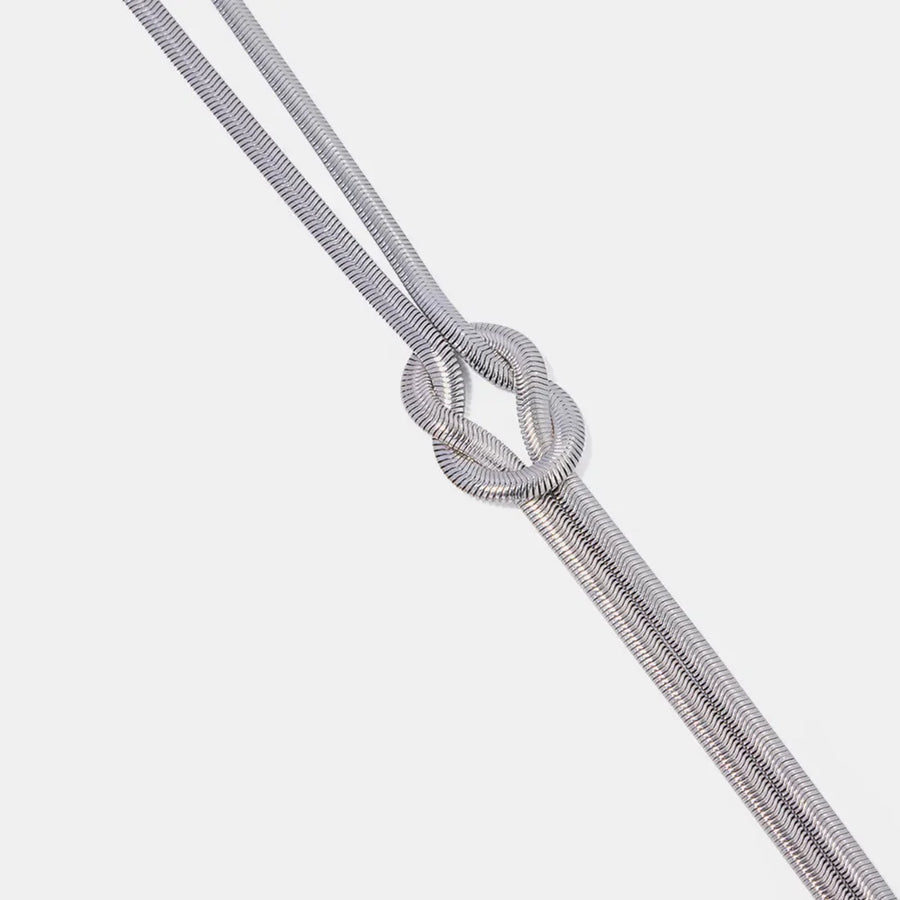 Silver herringbone knot necklace with a flat, sleek chain.