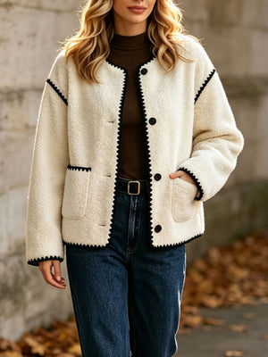 jacket in ivory featuring faux shearling and boxy fit
