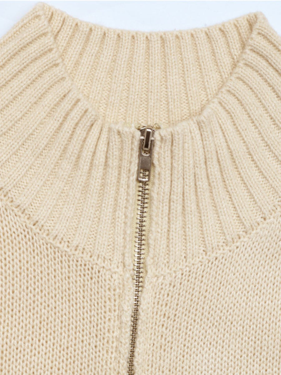 Ribbed knit zip-front vest in tan acrylic with a silver zipper detail.