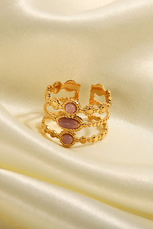 Gold triple stone openwork ring with pink stones and beaded detail