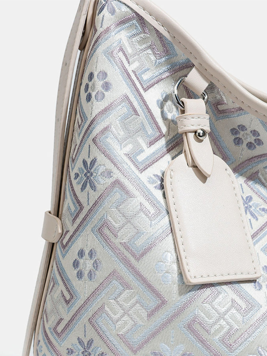 cream handbag with zip and geometric
