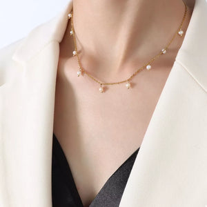 Freshwater Pearl, 18K Gold-Plated, Titanium Steel Care instructions: Imported Si necklace in ivory with fitted silhouette