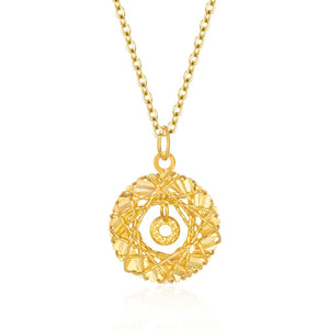 Gold-plated sterling pendant necklace with intricate circular design and small inner circle charm.