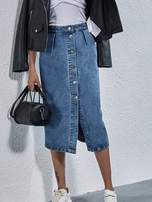 Button-front denim midi skirt in light wash with pleats and a slit.