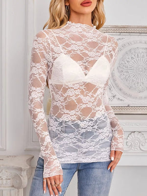 Pink blouse featuring lace and floral