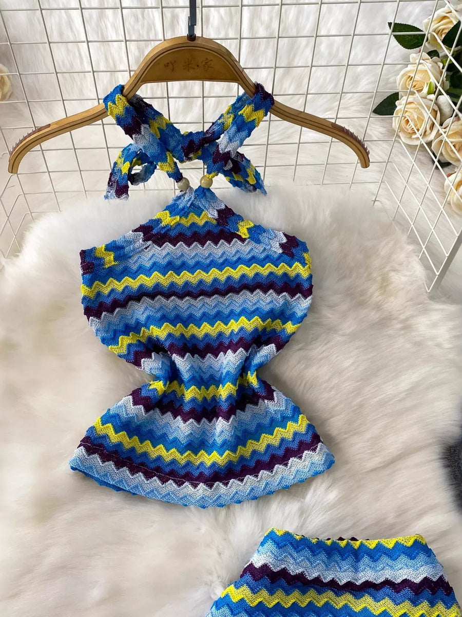 Chevron knit halter crop top and maxi skirt set in blue, yellow, and purple zigzag pattern.