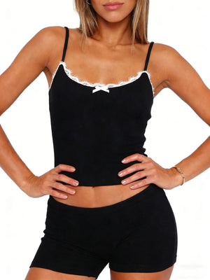 Black lace-trimmed cami with bow detail and matching shorts.