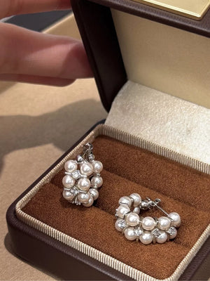 earrings in ivory featuring pearl embellishment and hoop fit