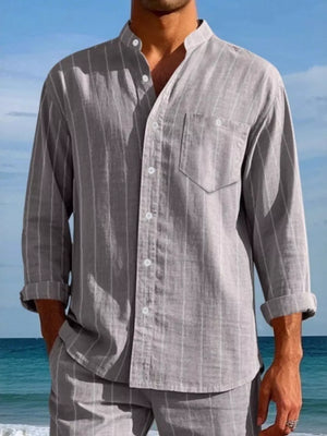 Men's grey linen-blend striped button-up shirt with band collar and chest pocket.