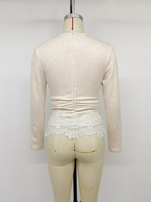 Beige long sleeve top with white lace trim and ruched waist
