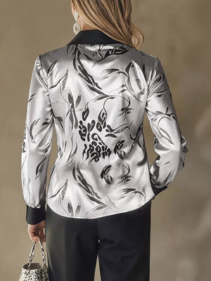 black button-up shirt featuring collared and leopard-print