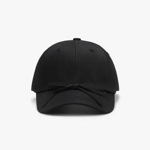 Black baseball cap with a tied bow detail on the brim