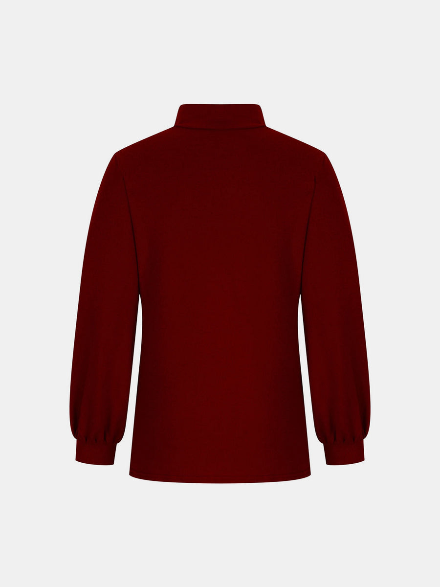 Burgundy mock neck top with puff sleeves and button back detail