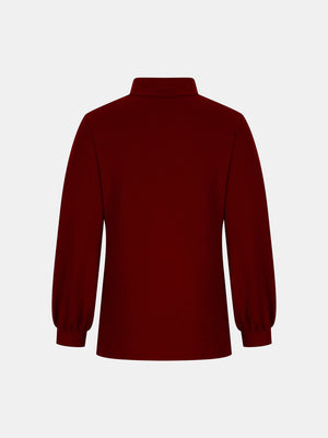 Burgundy mock neck top with puff sleeves and button back detail