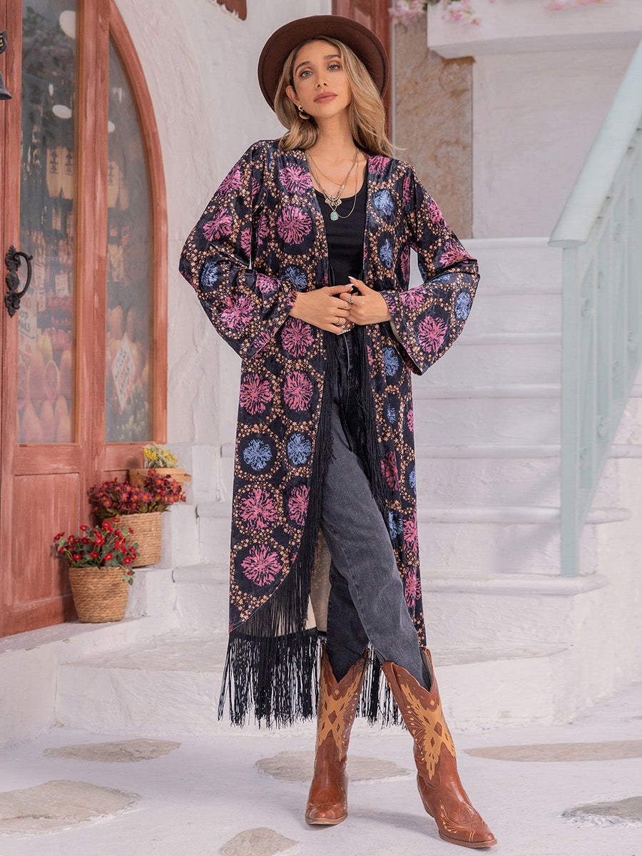 Bohemian floral duster with fringe, bell sleeves, and multicolor pattern.