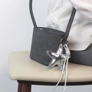 handbag in charcoal featuring zipper closure and boxy fit