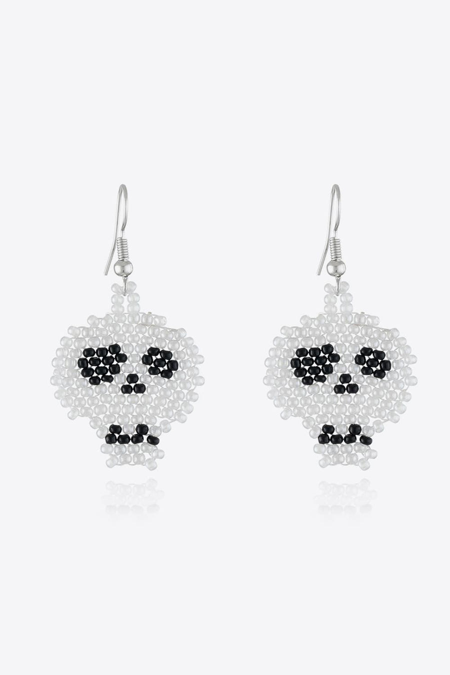 Beaded Skull earrings in white and black, featuring beaded eyes and mouth detail.