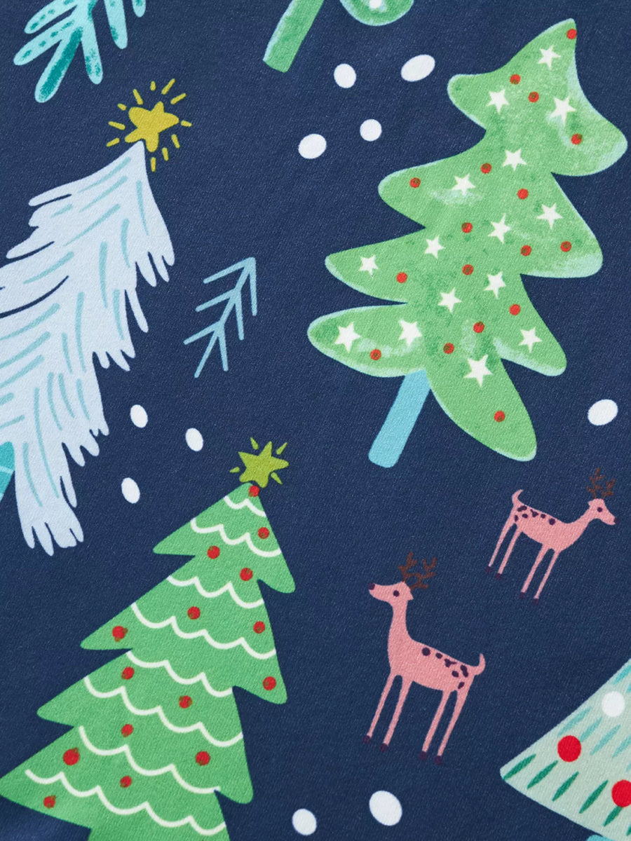 Children's Christmas pajama fabric in French Blue with a pattern of trees and reindeer.