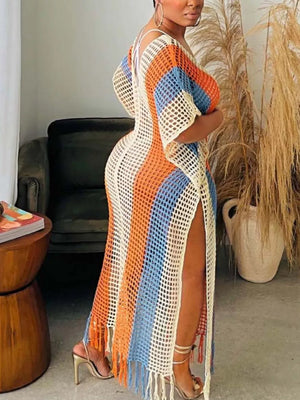 Vibrant striped crochet cover-up dress with fringe hem and high slits.