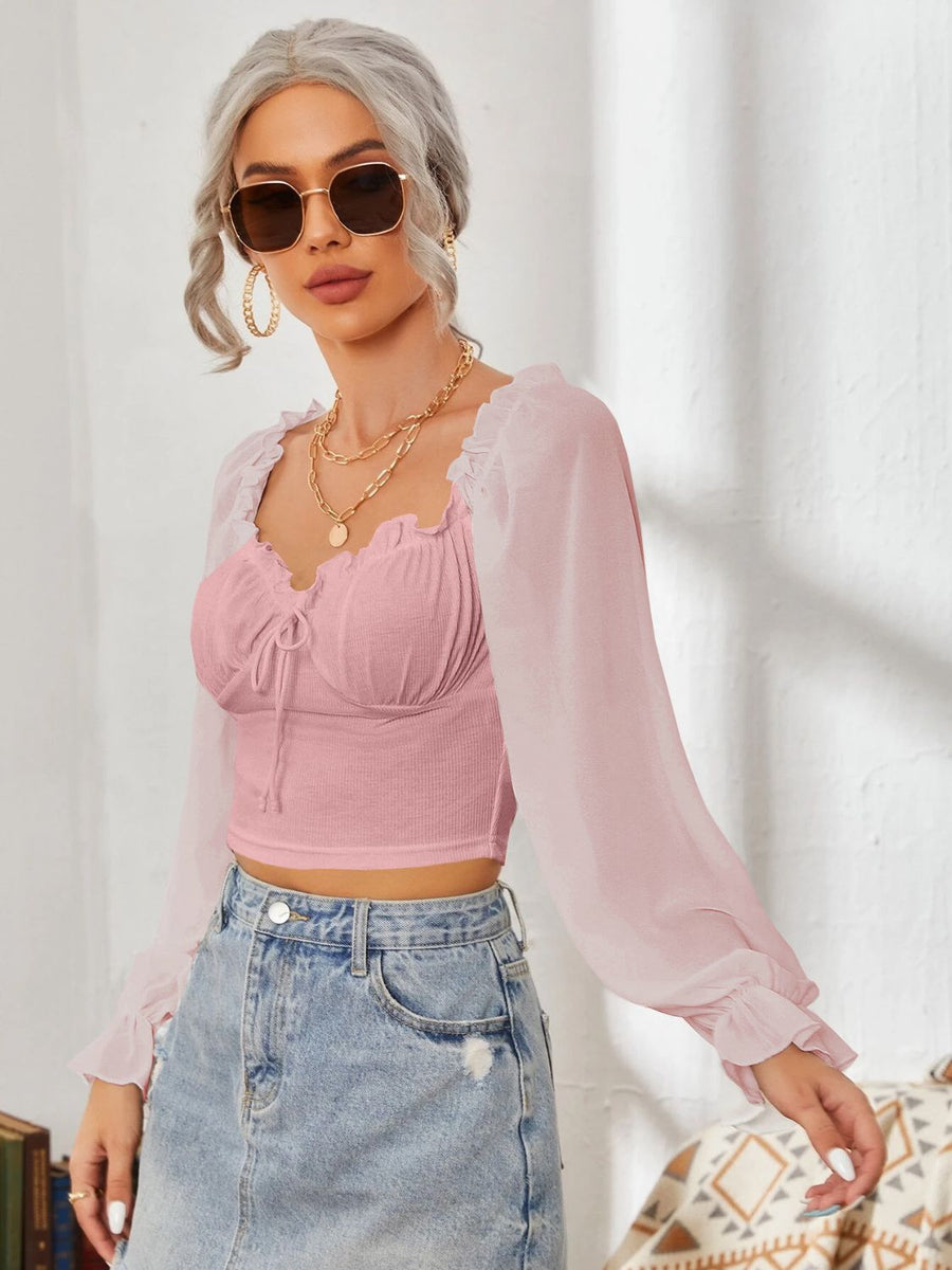 Pink bustier crop blouse with tie front and sheer puff sleeves