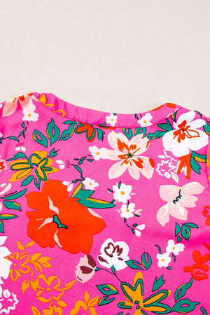 Hot pink floral print tunic with gathered sleeves and a crew neck.