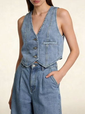Light blue denim vest with button front and a chest pocket.