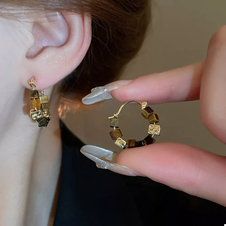 earrings in golden yellow featuring geometric beads and circular fit