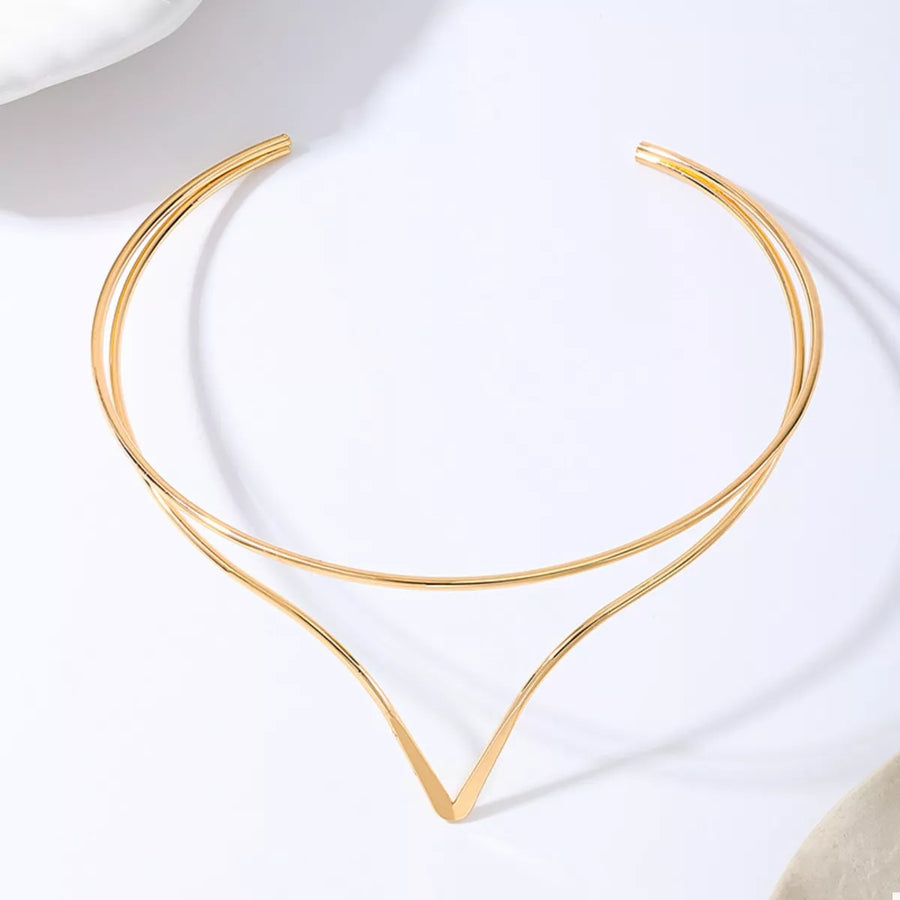 Golden V-shaped double layer choker necklace with thin metal bands.