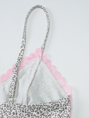 Leopard print camisole with pink lace trim and adjustable straps.