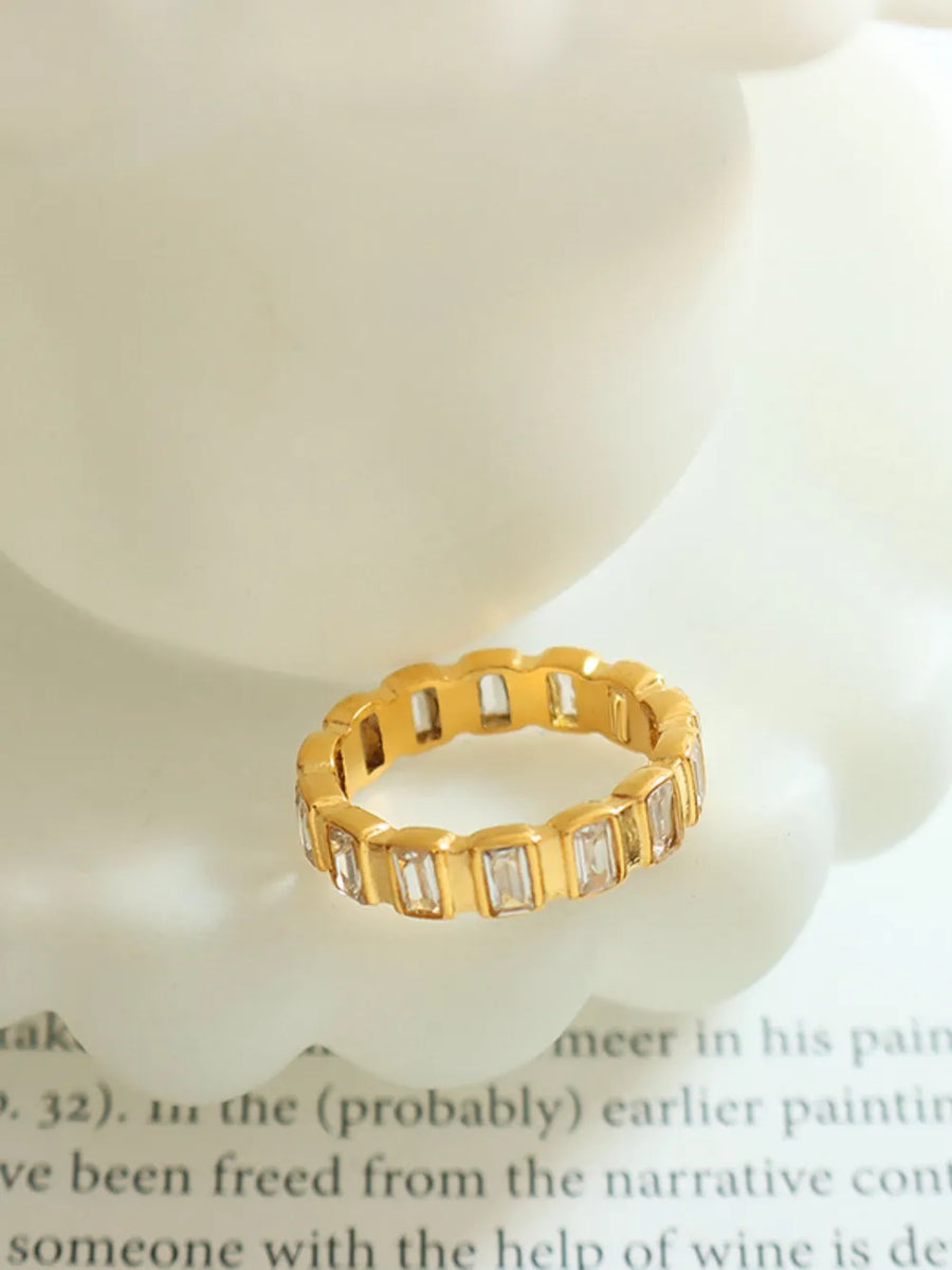 Gold baguette eternity ring with clear stones