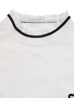 black pullover sweater with pullover and bow motif