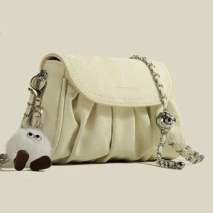 Mini ruched pu leather shoulder bag in pastel yellow with chain strap and fuzzy charm