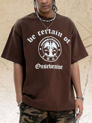 Brown oversized graphic t-shirt with white vintage-inspired print and crew neck.