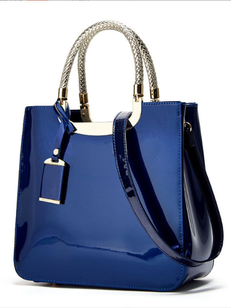 handbag in Blue with metallic handle and medium