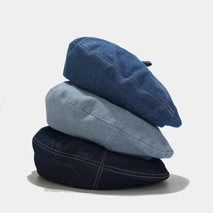 hat in dark wash denim featuring visible stitching and slouchy fit