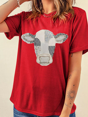 black t-shirt featuring patchwork graphic and graphic