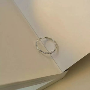 ring in silver with textured and open band