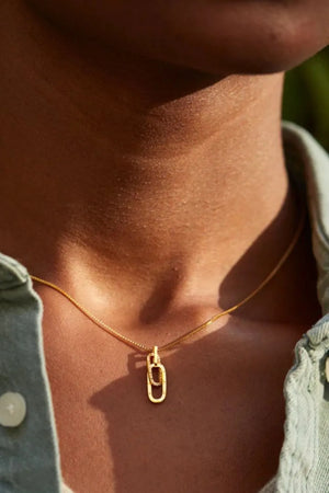 Gold linked pendant necklace with zirconia detail on a delicate chain
