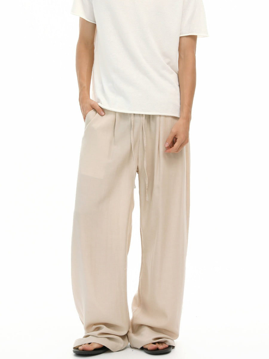 light beige wide-leg pants with full-length and drawstring