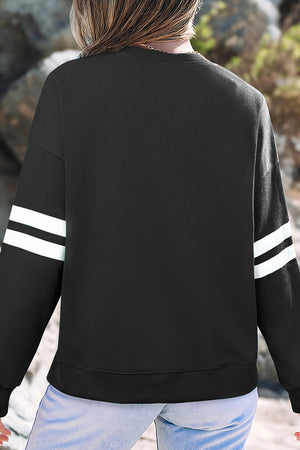 65% polyester, 35% cotton Care instructions: Machine wash cold sweatshirt in black with relaxed silhouette