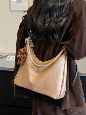 crossbody bag in Black with stitching detail and medium