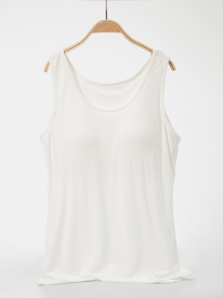 White scoop neck tank top with a relaxed fit.