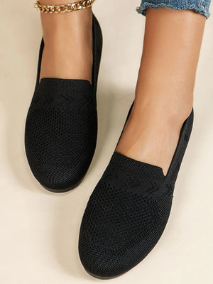 Black breathable knit slip-on loafers with a textured detail across the vamp.